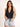 Model is wearing a black sleeveless surplice bodysuit.