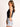 Model is wearing a black sleeveless surplice bodysuit.
