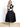 Model is wearing a black swing midi skirt.