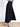 Model is wearing a black swing midi skirt.