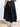 Model is wearing a black swing midi skirt.