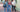 three women wearing fall transition outfits outside of a college building