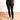 Model is wearing black Spanx faux leather leggings 