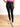 Model is wearing black Spanx faux leather leggings 