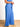 Model is wearing blue tie waist wide leg pants.