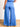 Model is wearing blue tie waist wide leg pants.