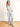 Model is wearing dove grey wide leg pants.