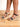 Model is wearing black and ivory crochet trim wedge sandals.