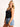 Model is wearing a long black seamless u-neck tank.