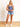 Model is wearing a long blue seamless u-neck tank.