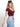 Model is wearing a maroon short sleeve v-neck top.