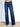 Model is wearing dark wash denim jeans.