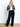 Model is wearing navy wide leg dress pants.
