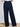 Model is wearing navy wide leg dress pants.