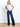 Model is wearing dark wash denim jeans.