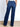 Model is wearing dark wash denim jeans.