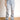 Model wearing light wash, distressed, baggy jeans.