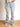 Model wearing light wash, distressed, baggy jeans.