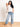 Model is wearing medium wash mid rise cropped wide leg jeans.