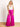 Model is wearing pink silky wide leg pants with tie waist.