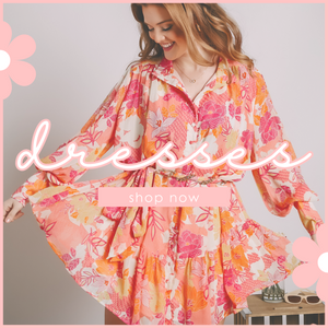 Model is wearing a pastel pink floral long sleeve dress. Show our dresses now!