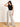 Model is wearing cream/black stripe linen pants.