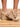 Model is wearing tan crochet trim wedge sandals.
