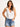 Model is wearing a white sleeveless surplice bodysuit.