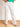 Model is wearing white super high rise flare jeans.